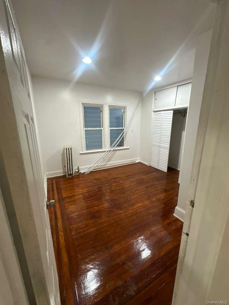 3581 Eastchester Road, Unit 2 Bronx, NY 10469 - Photo 8 of 13 a view of empty room with wooden floor