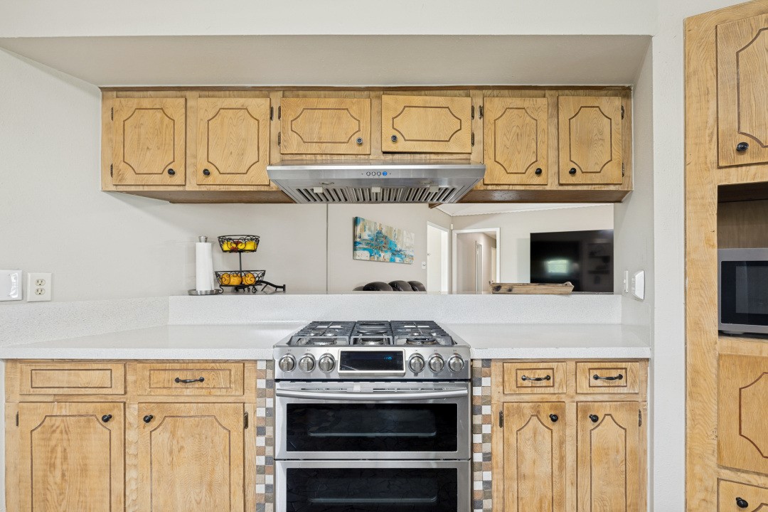 2500 County Road 62 Rosharon, TX 77583 - Photo 21 of 48 a stove top oven sitting inside of a kitchen