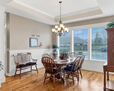 a view of a dining room with furniture window and outside view