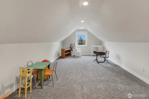 a living room with furniture and a chair