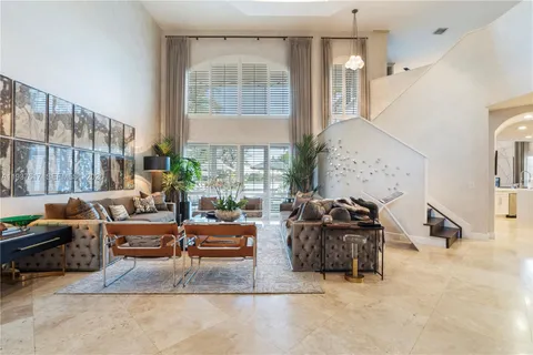 a kitchen with a refrigerator and a stove top oven