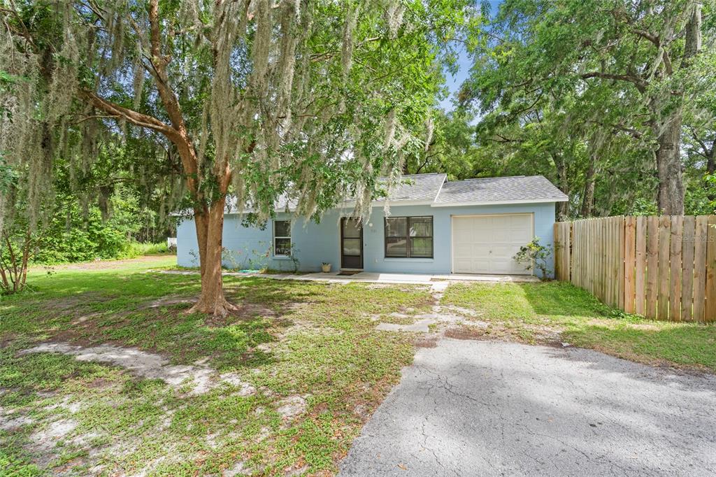 7686 Southwest 81st Street Ocala, FL 34476 - Photo 1 of 1 a view of a house with a yard and tree