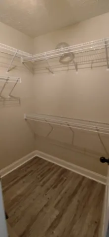 a view of a room with an empty walk in closet