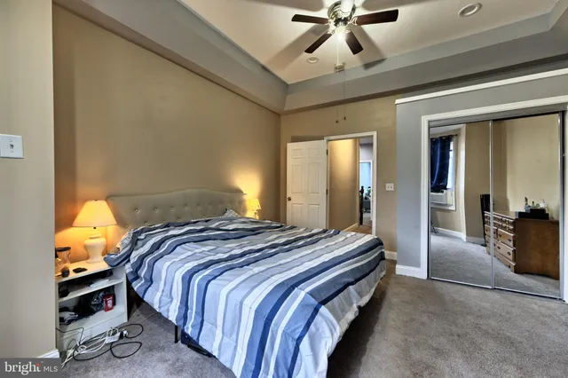 a bedroom with bed and window