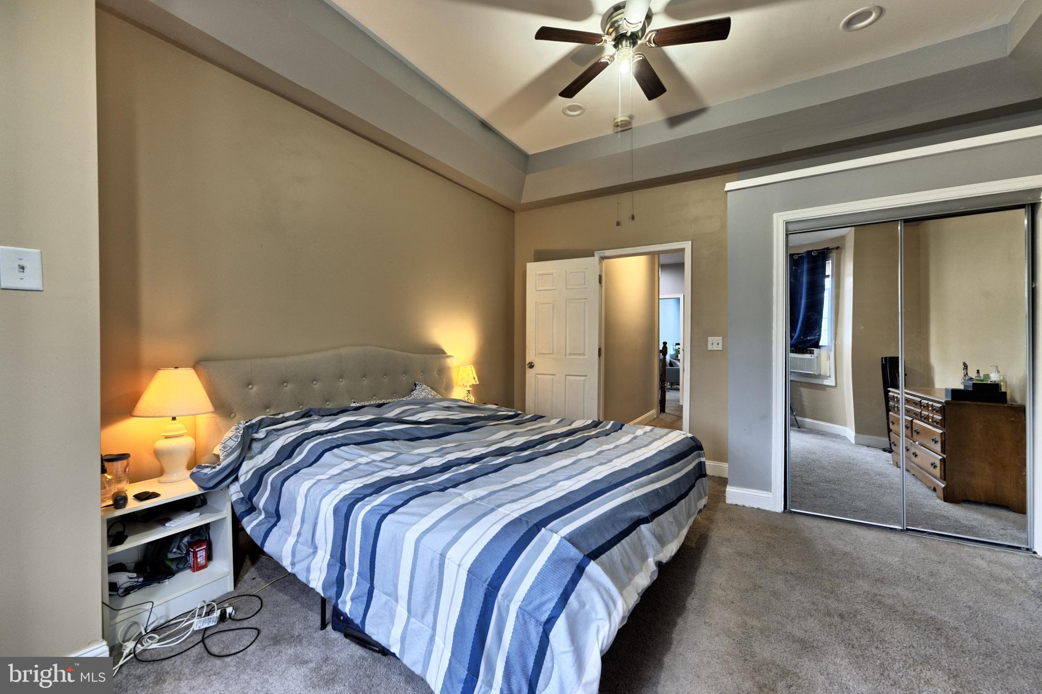 318 East 28th Street Baltimore, MD 21218 - Photo 14 of 20 a bedroom with bed and window