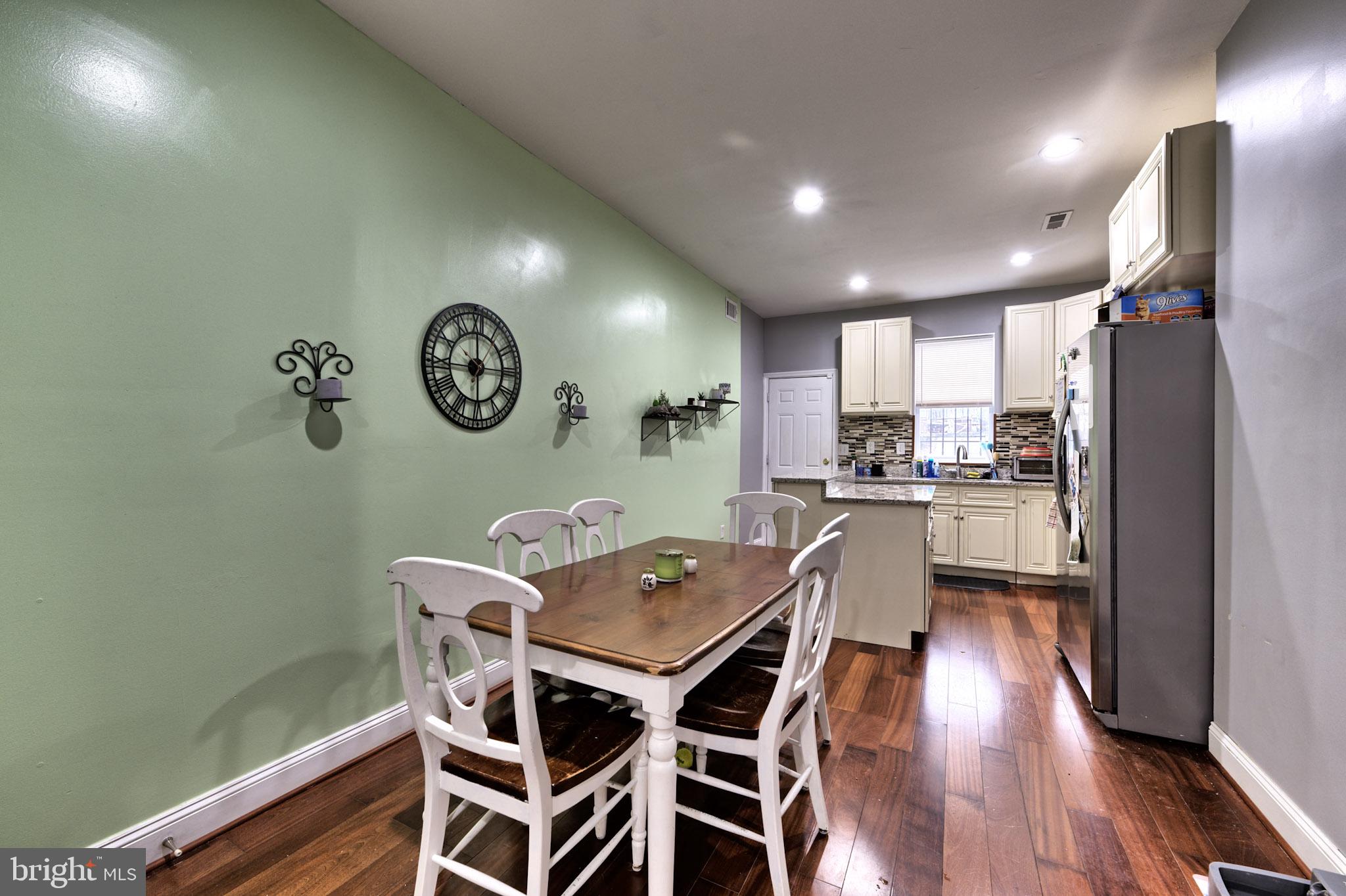 318 East 28th Street Baltimore, MD 21218 - Photo 10 of 20 a view of a dining room with furniture window and wooden floor