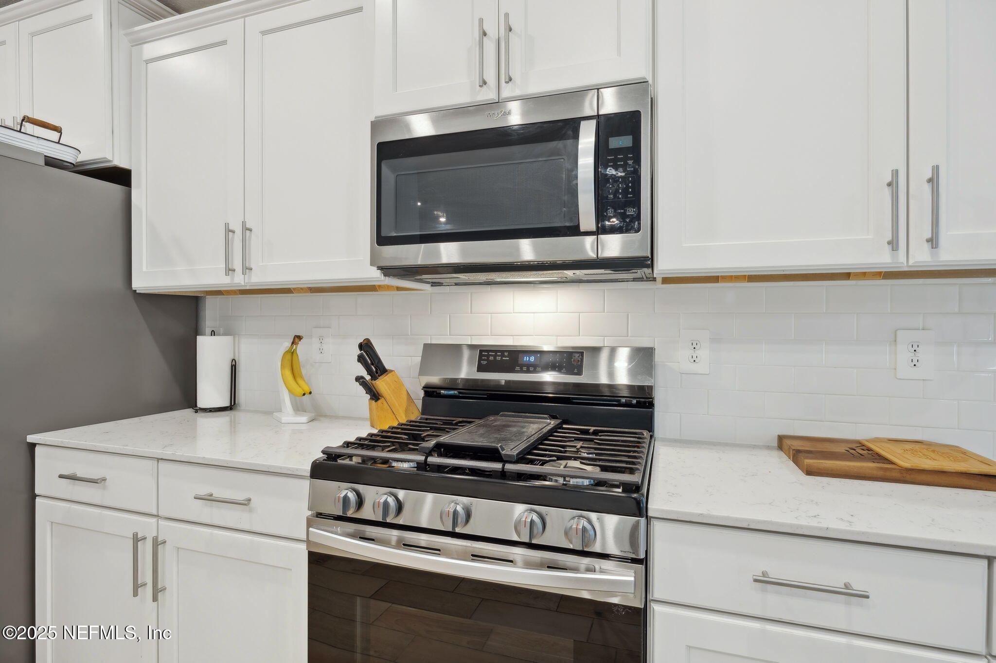 34 Riva Ridge Court Jacksonville, FL 32218 - Photo 12 of 34 a kitchen with stainless steel appliances granite countertop white cabinets and a stove top oven