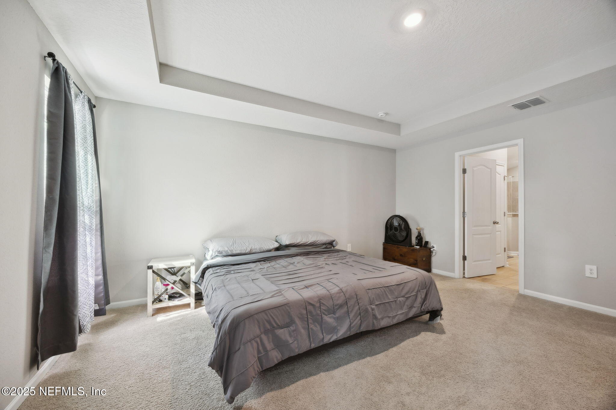 34 Riva Ridge Court Jacksonville, FL 32218 - Photo 17 of 34 a bedroom with a bed and a window