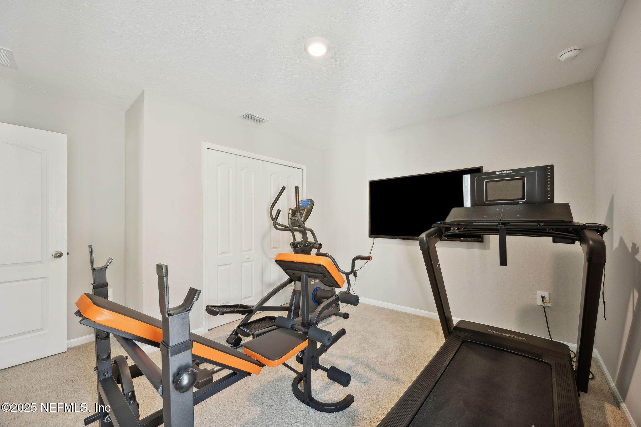 34 Riva Ridge Court Jacksonville, FL 32218 - Photo 23 of 34 a room with gym equipment and windows