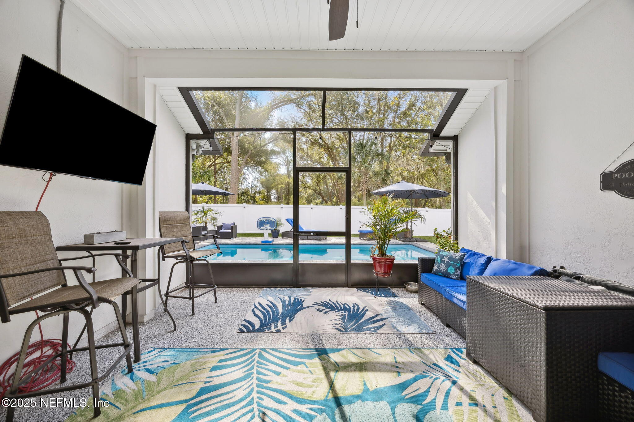 34 Riva Ridge Court Jacksonville, FL 32218 - Photo 28 of 34 a living room with furniture and a floor to ceiling window