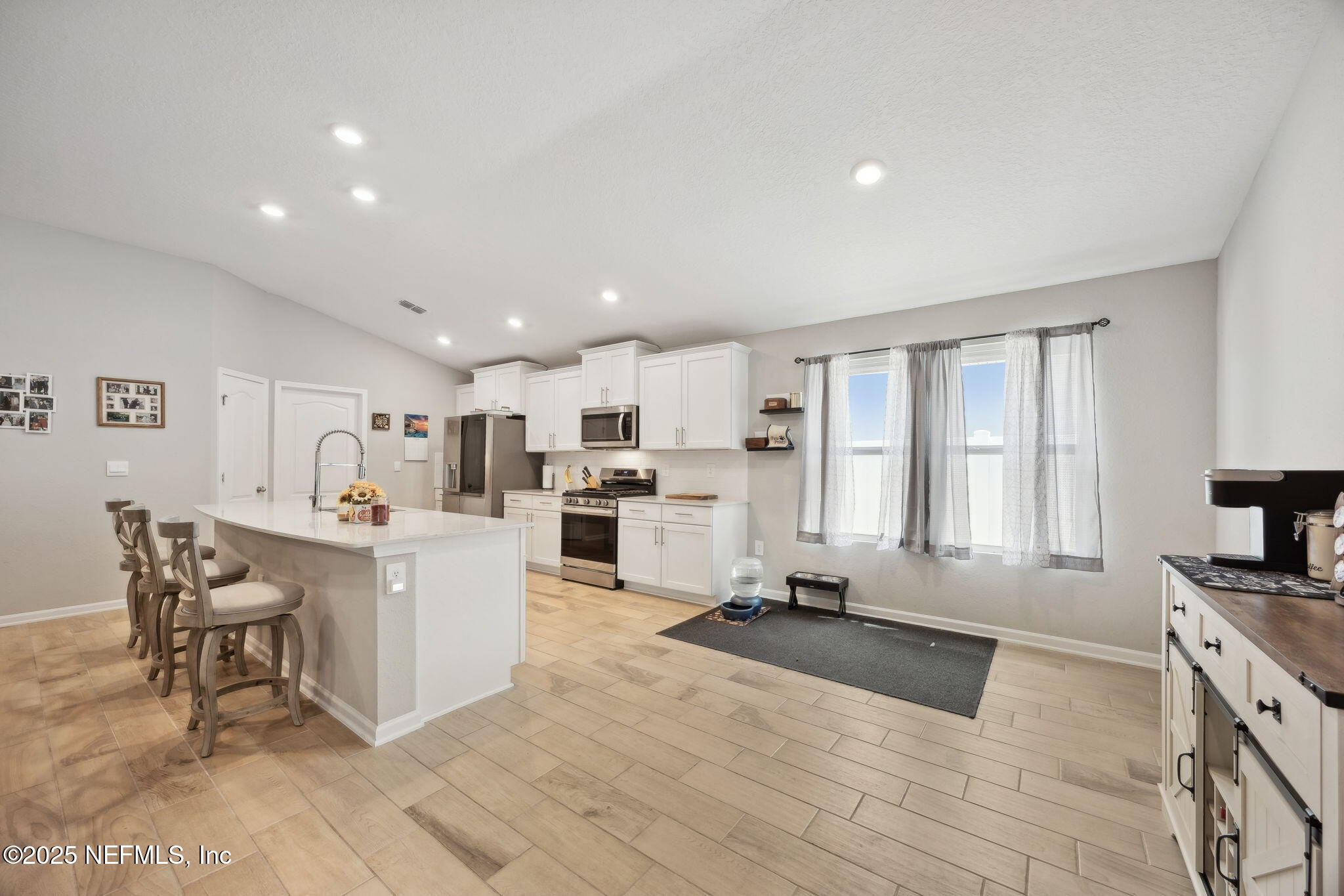 34 Riva Ridge Court Jacksonville, FL 32218 - Photo 10 of 34 a large white kitchen with lots of counter top space a sink appliances and cabinets