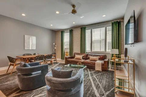 a dining room with furniture and window