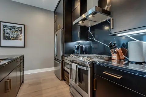 a bedroom with a bed lamp and window