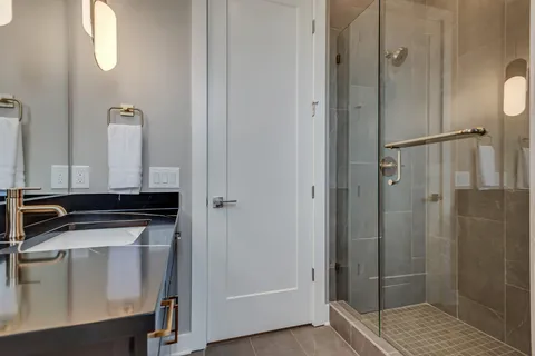 a bedroom with bed and window