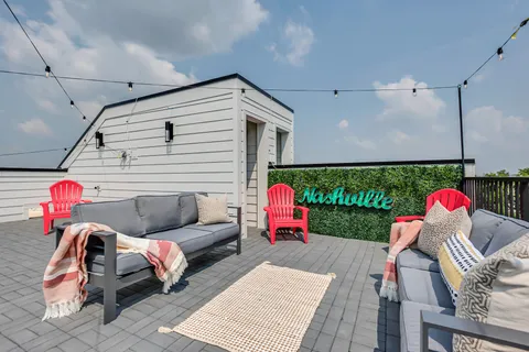 a balcony with couch and outdoor view