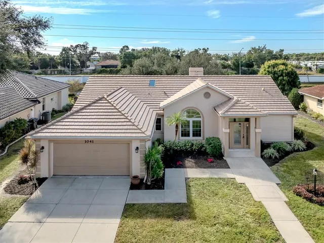 a aerial view of a house with a yard