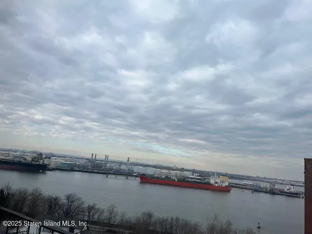 a view of a lake with houses in the back