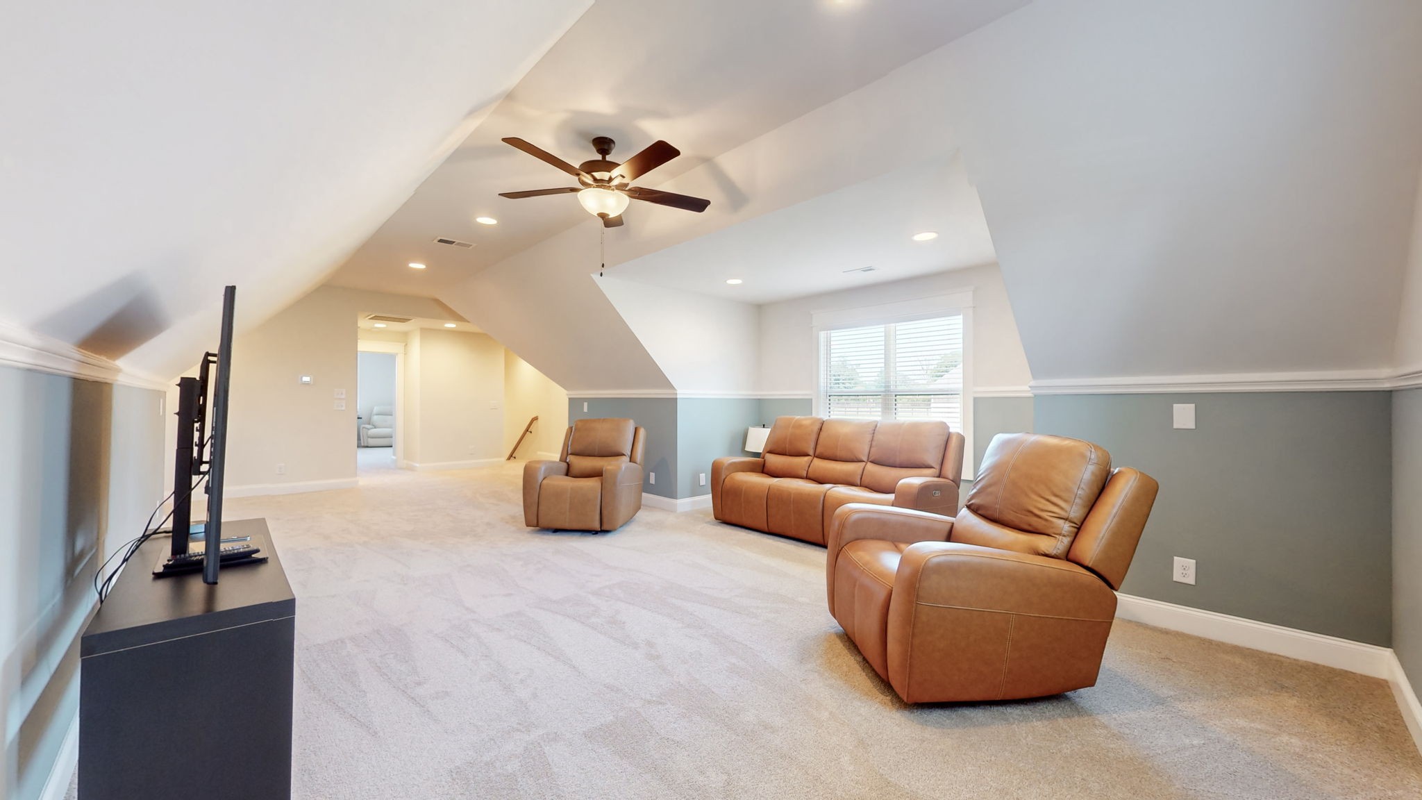 540 Bradshaw Road Lebanon, TN 37087 - Photo 38 of 65 a living room with furniture a ceiling fan and a rug
