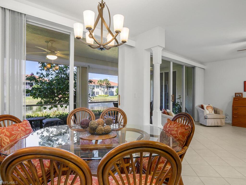23831 San Marino Road, Unit 102 Estero, FL 34135 - Photo 15 of 39 Dining space featuring a ceiling fan and healthy amount of natural light