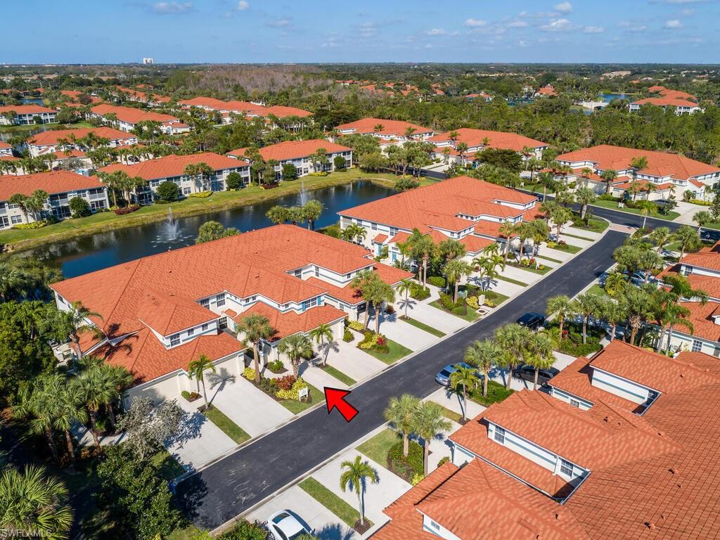 23831 San Marino Road, Unit 102 Estero, FL 34135 - Photo 31 of 39 Aerial view of residential area featuring a nearby body of water