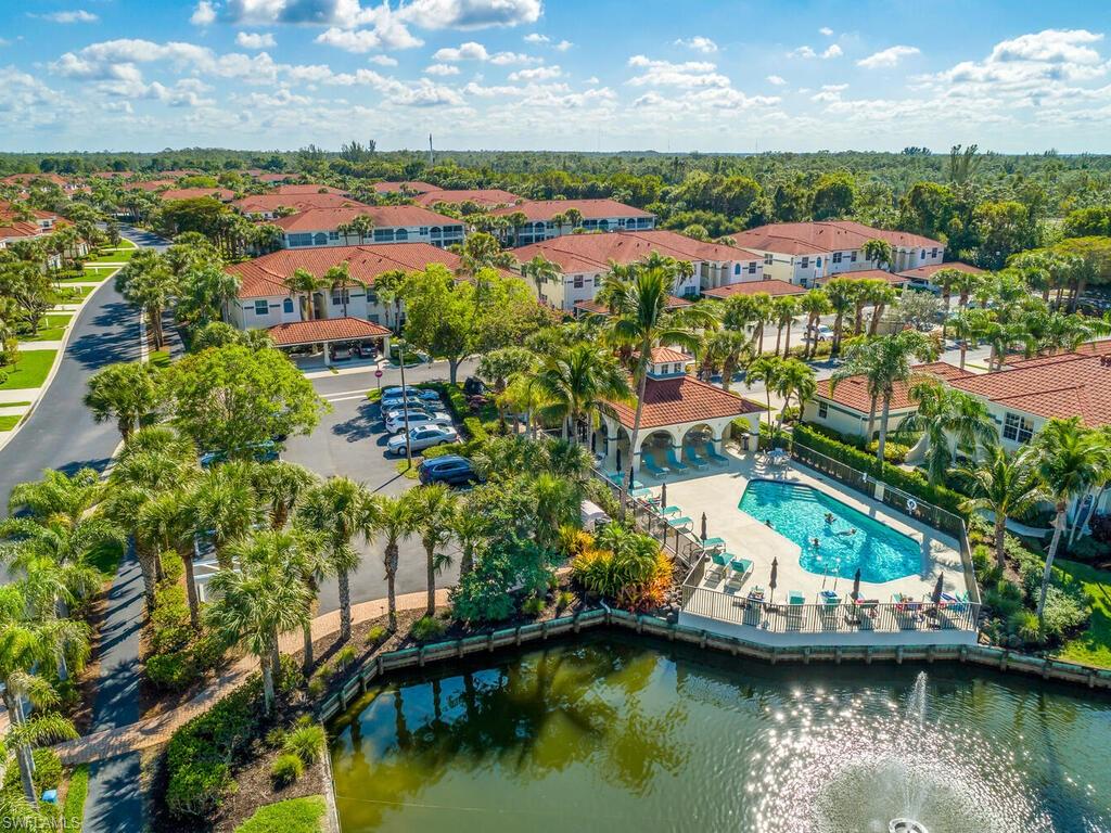 23831 San Marino Road, Unit 102 Estero, FL 34135 - Photo 39 of 39 Aerial view of a pool area