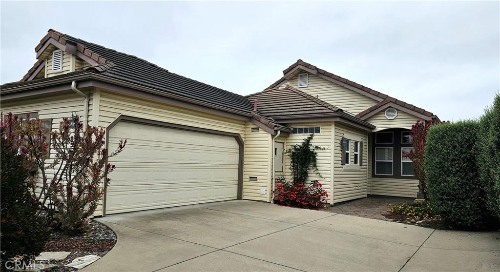 a front view of a house with garage