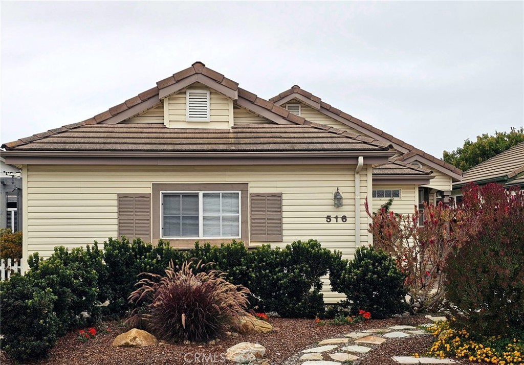 516 Morning Rise Lane Arroyo Grande, CA 93420 - Photo 2 of 16 a front view of a house with garden