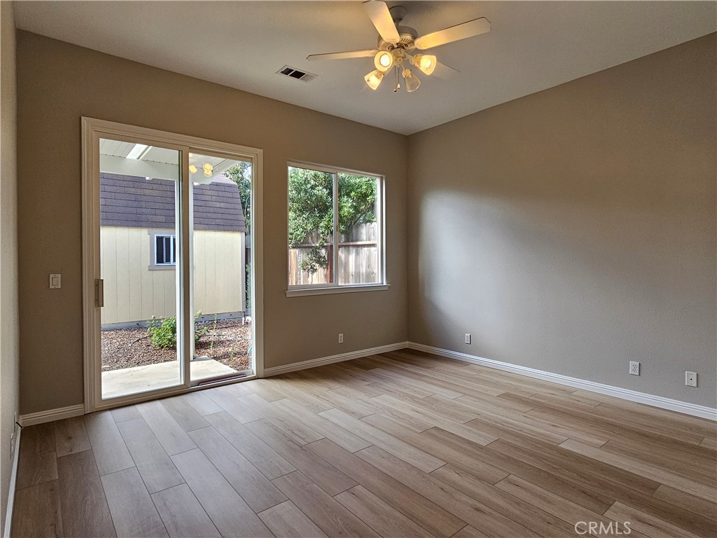 516 Morning Rise Lane Arroyo Grande, CA 93420 - Photo 7 of 16 an empty room with wooden floor and windows