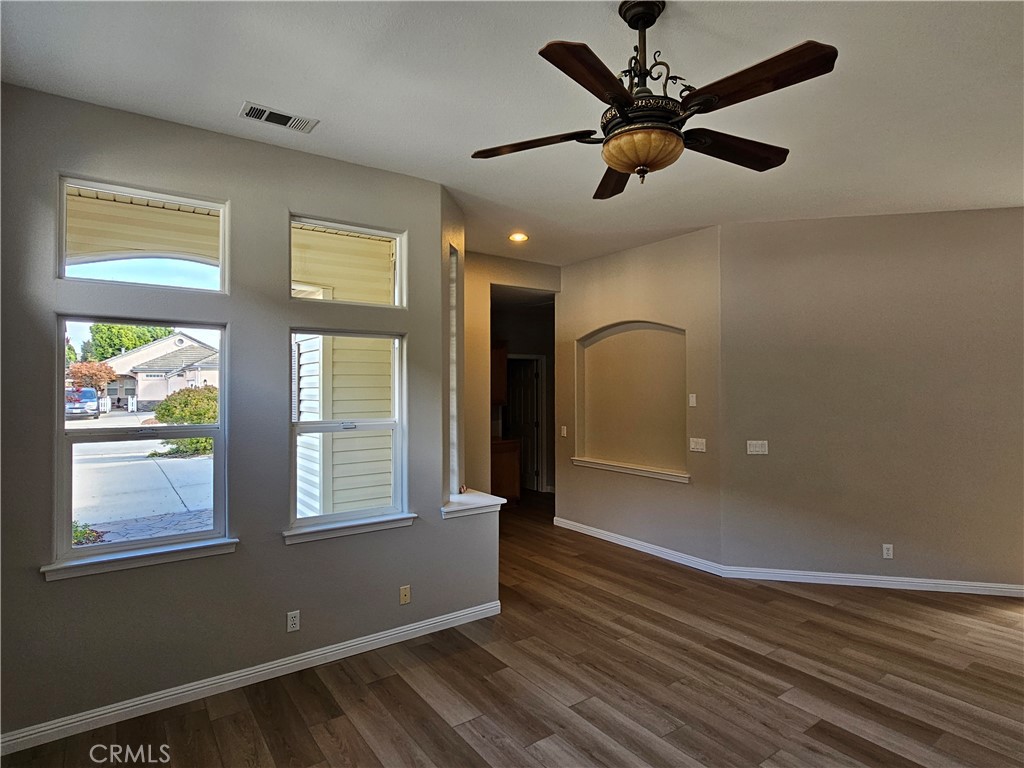 516 Morning Rise Lane Arroyo Grande, CA 93420 - Photo 8 of 16 a view of an empty room with a window and wooden floor