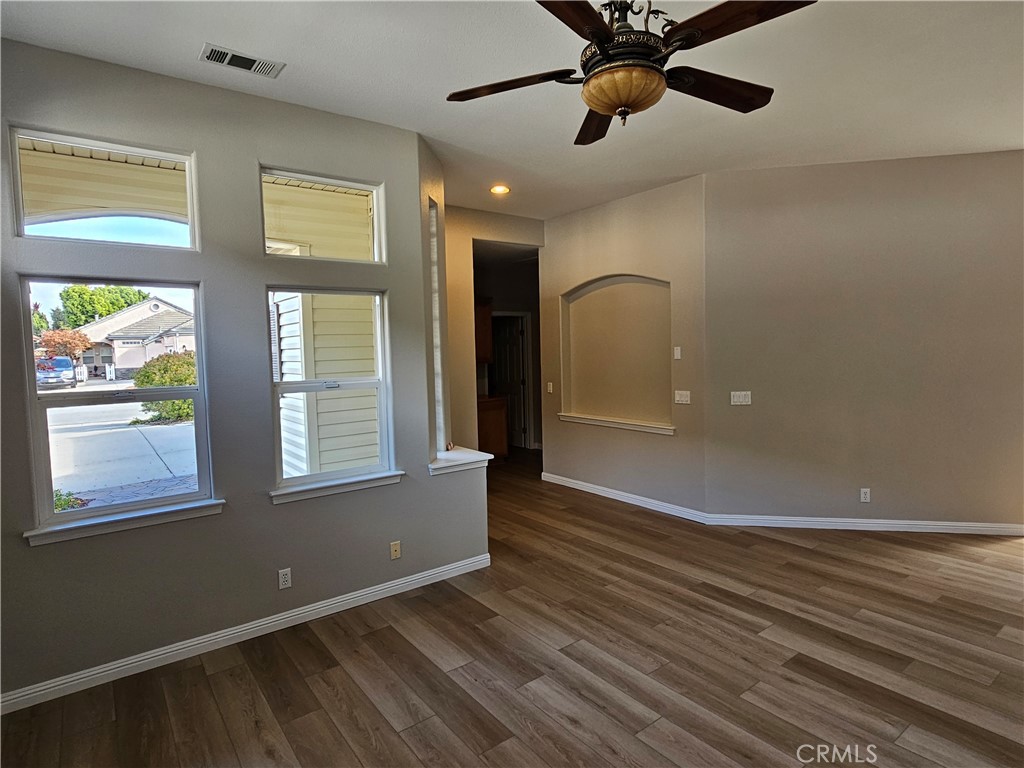 516 Morning Rise Lane Arroyo Grande, CA 93420 - Photo 9 of 16 a view of an empty room with a window and wooden floor