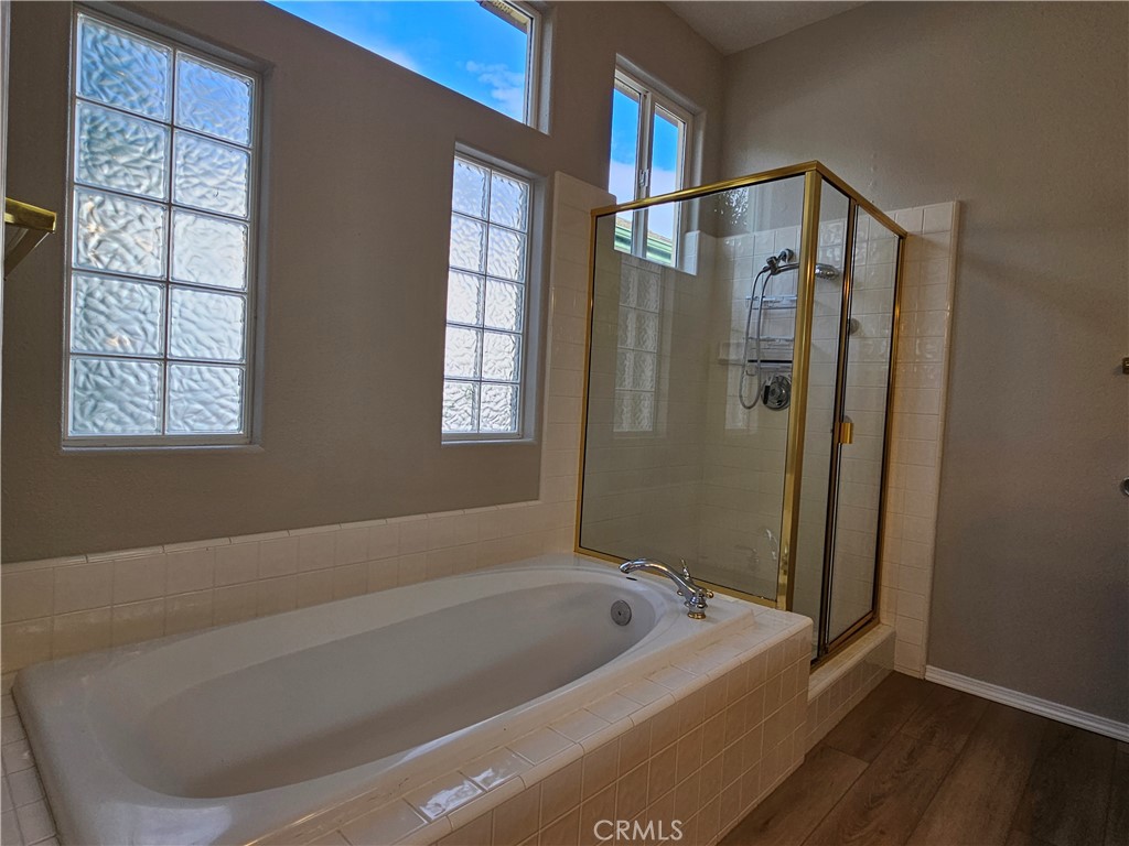 516 Morning Rise Lane Arroyo Grande, CA 93420 - Photo 10 of 16 a bathroom with a tub a shower and a window