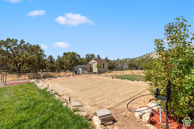 11450 Pigeon Hollow Road Spring City, UT 84662 - Photo 34 of 47 View of patio / terrace featuring an outbuilding and view of scattered trees