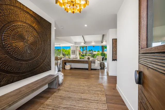 a living room with furniture and a rug