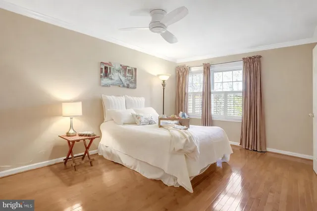 a spacious bathroom with a granite countertop sink and a mirror