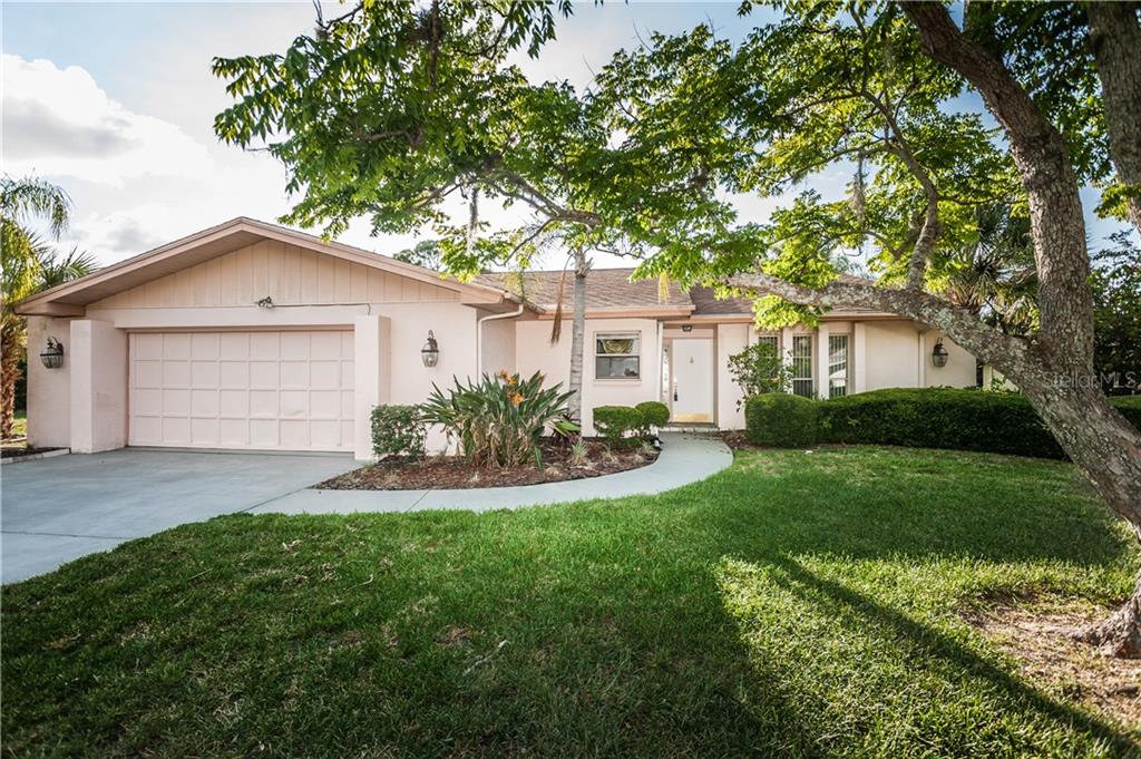 5459 Nimitz Road New Port Richey, FL 34652 - Photo 1 of 1 Front of home with resurfaced driveway!