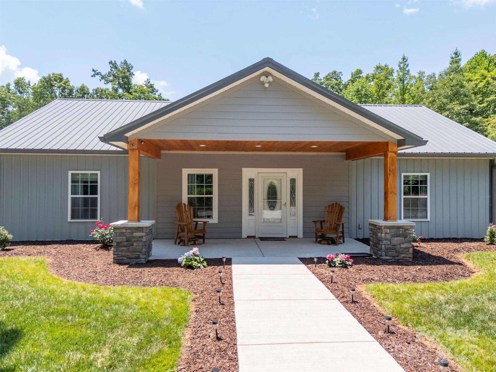 107 Grandview Drive Rutherfordton, NC 28139 - Photo 4 of 37 a front view of house with yard outdoor seating and green space