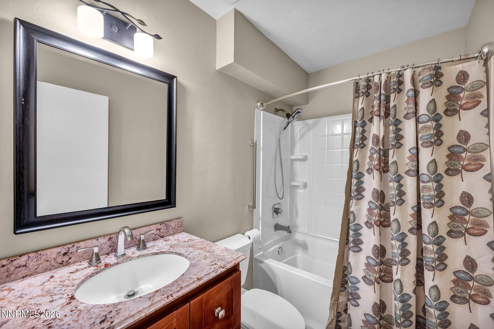 1970 Geiger Grade Road Reno, NV 89521 - Photo 33 of 45 a bathroom with a granite countertop sink and a mirror