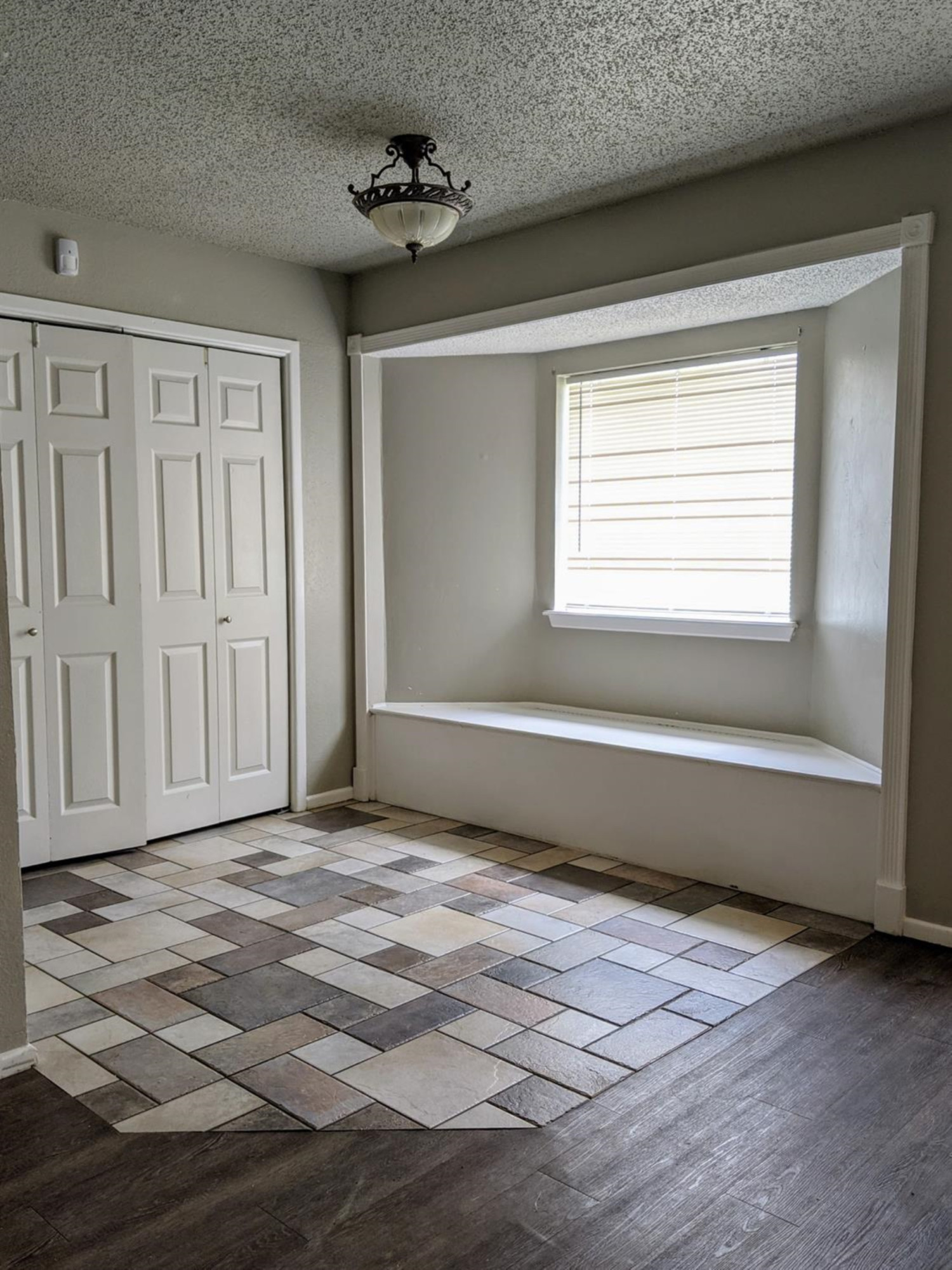 5525 Fordham Street Lubbock, TX 79416 - Photo 4 of 12 a view of an empty room with a window