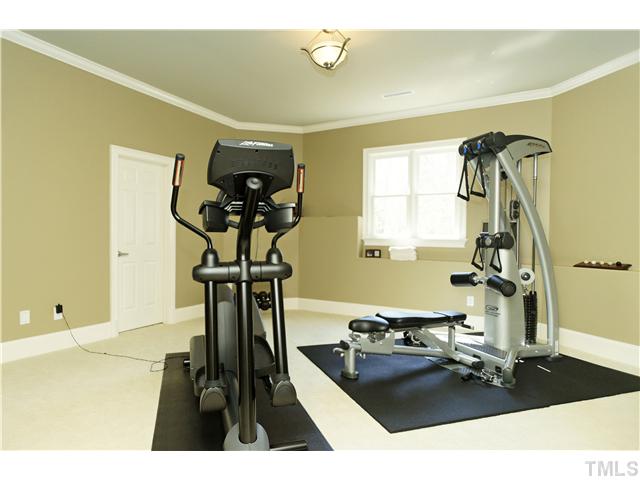 1001 Salcomb Lane Raleigh, NC 27614 - Photo 19 of 25 Don't miss the fun indoor basketball playroom located off this exercise space. Use for play or just for storage.