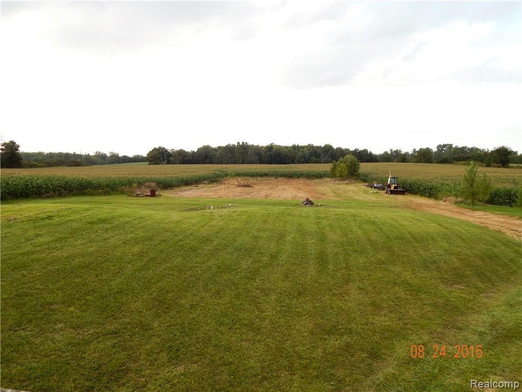 9792 Judd Road Fowlerville, MI 48836 - Photo 16 of 21 Back Yard. Backs up to cornfield