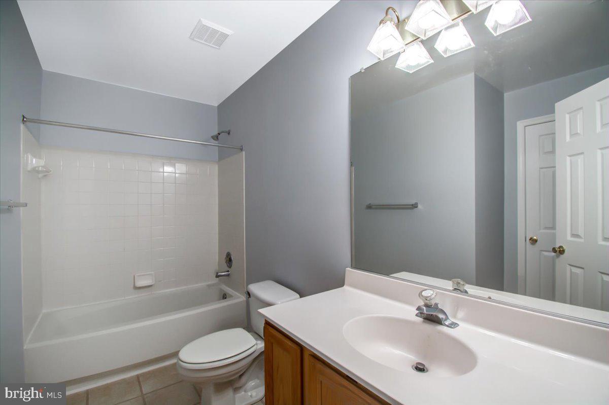 2207 Commissary Circle Odenton, MD 21113 - Photo 15 of 50 a bathroom with a sink a toilet and shower
