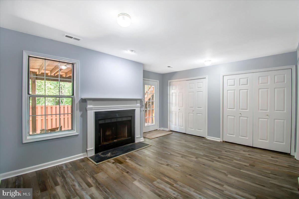 2207 Commissary Circle Odenton, MD 21113 - Photo 17 of 50 a view of an empty room with window and fire place