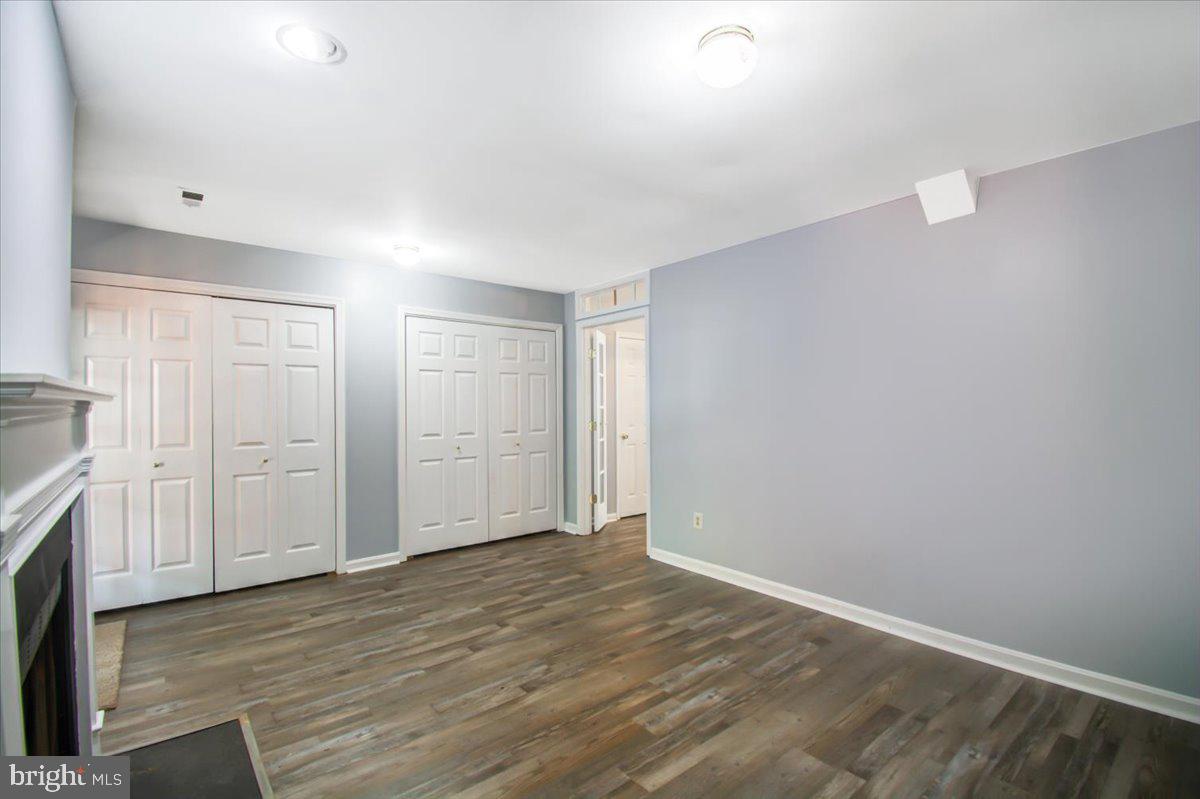 2207 Commissary Circle Odenton, MD 21113 - Photo 18 of 50 a view of an empty room with wooden floor