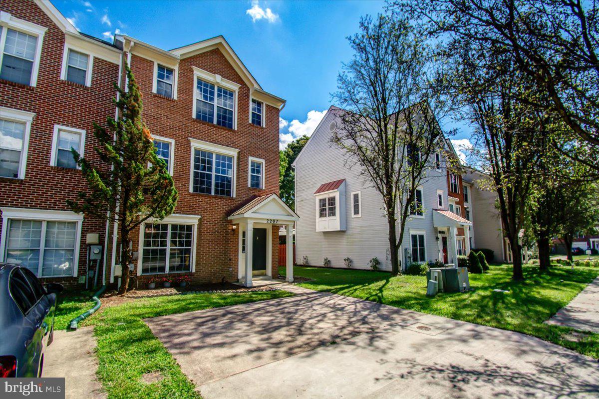 2207 Commissary Circle Odenton, MD 21113 - Photo 2 of 50 a front view of a house with a garden