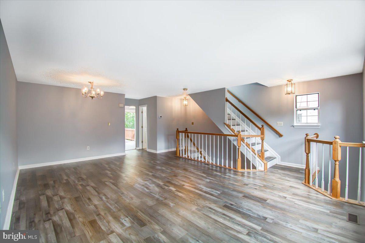 2207 Commissary Circle Odenton, MD 21113 - Photo 22 of 50 a view of entryway and hall with wooden floor