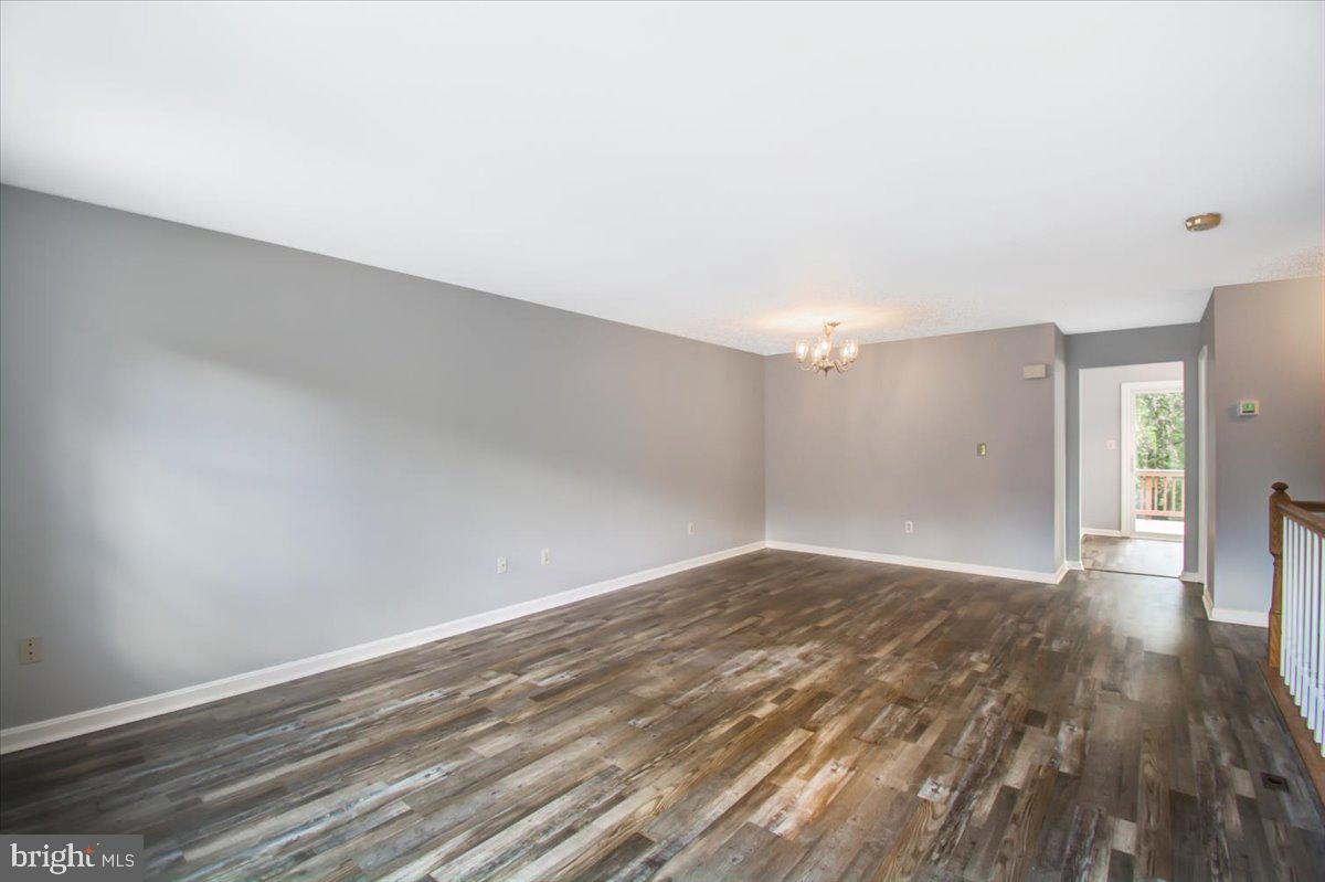 2207 Commissary Circle Odenton, MD 21113 - Photo 23 of 50 a view of empty room with wooden floor