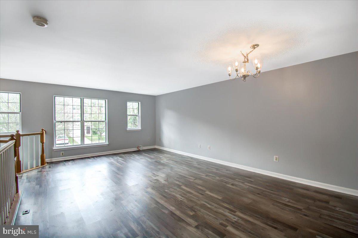 2207 Commissary Circle Odenton, MD 21113 - Photo 24 of 50 an empty room with wooden floor and window