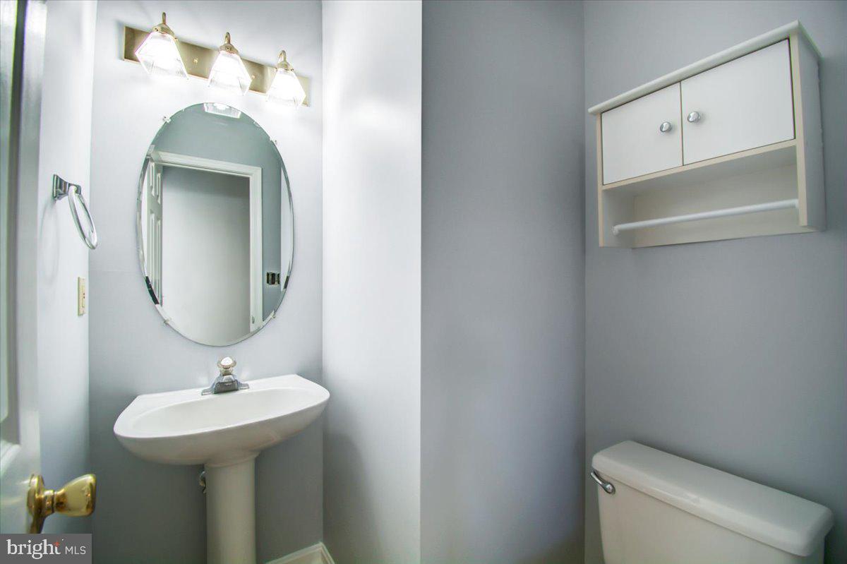 2207 Commissary Circle Odenton, MD 21113 - Photo 26 of 50 a bathroom with a sink and a mirror