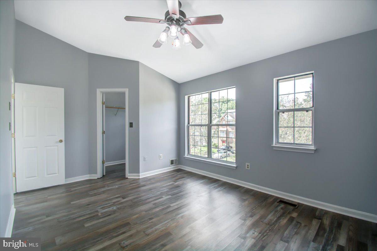2207 Commissary Circle Odenton, MD 21113 - Photo 28 of 50 a view of an empty room with wooden floor and a window