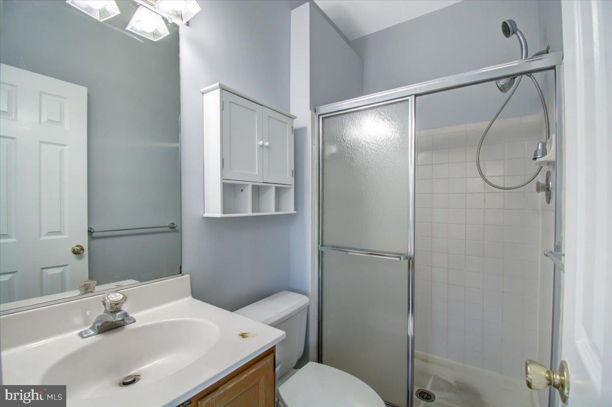 2207 Commissary Circle Odenton, MD 21113 - Photo 31 of 50 a bathroom with a sink toilet and shower